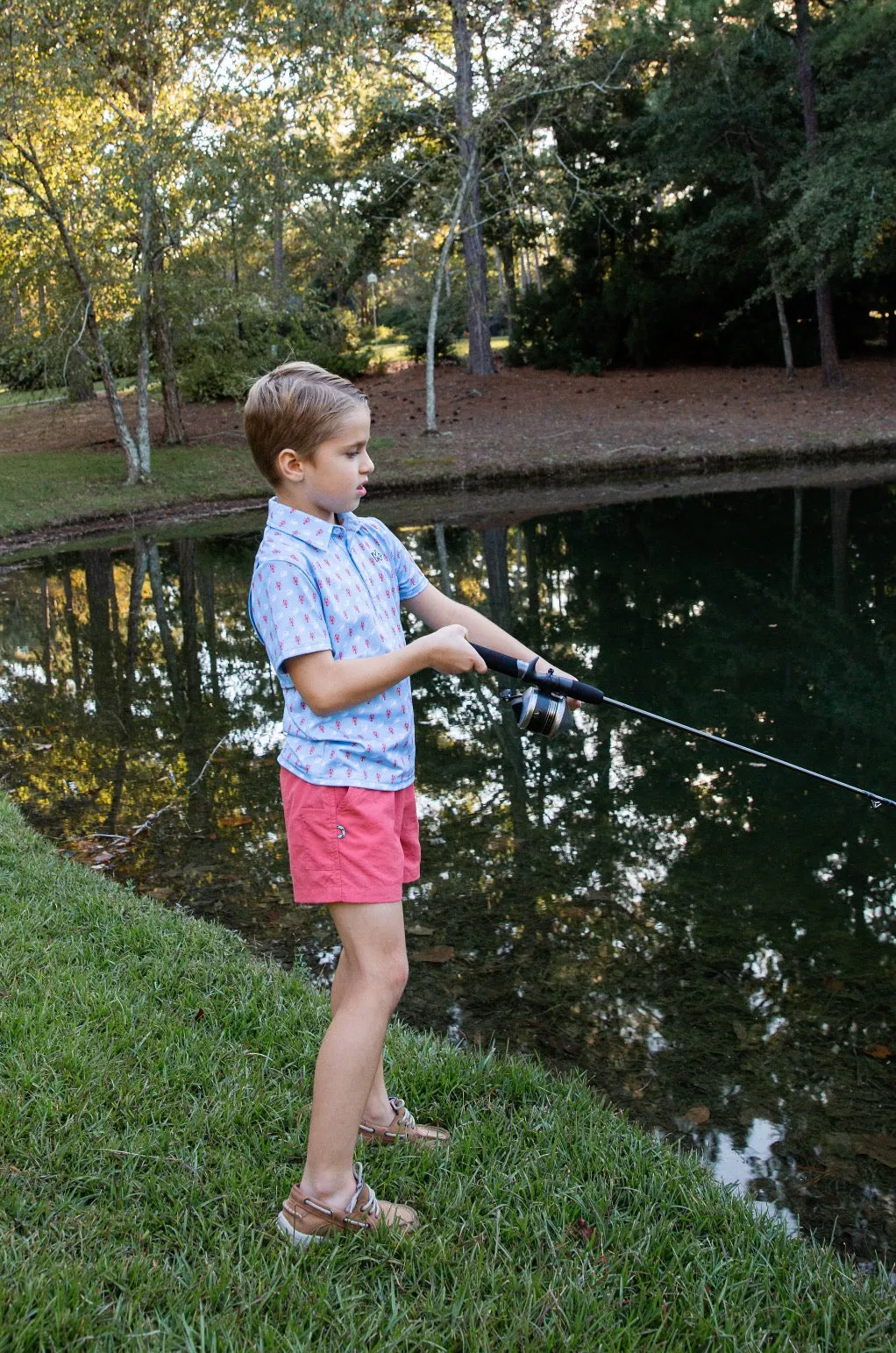 Boys Short Sleeve Pro Performance Polo in Crab and Lobster Print on Light Blue