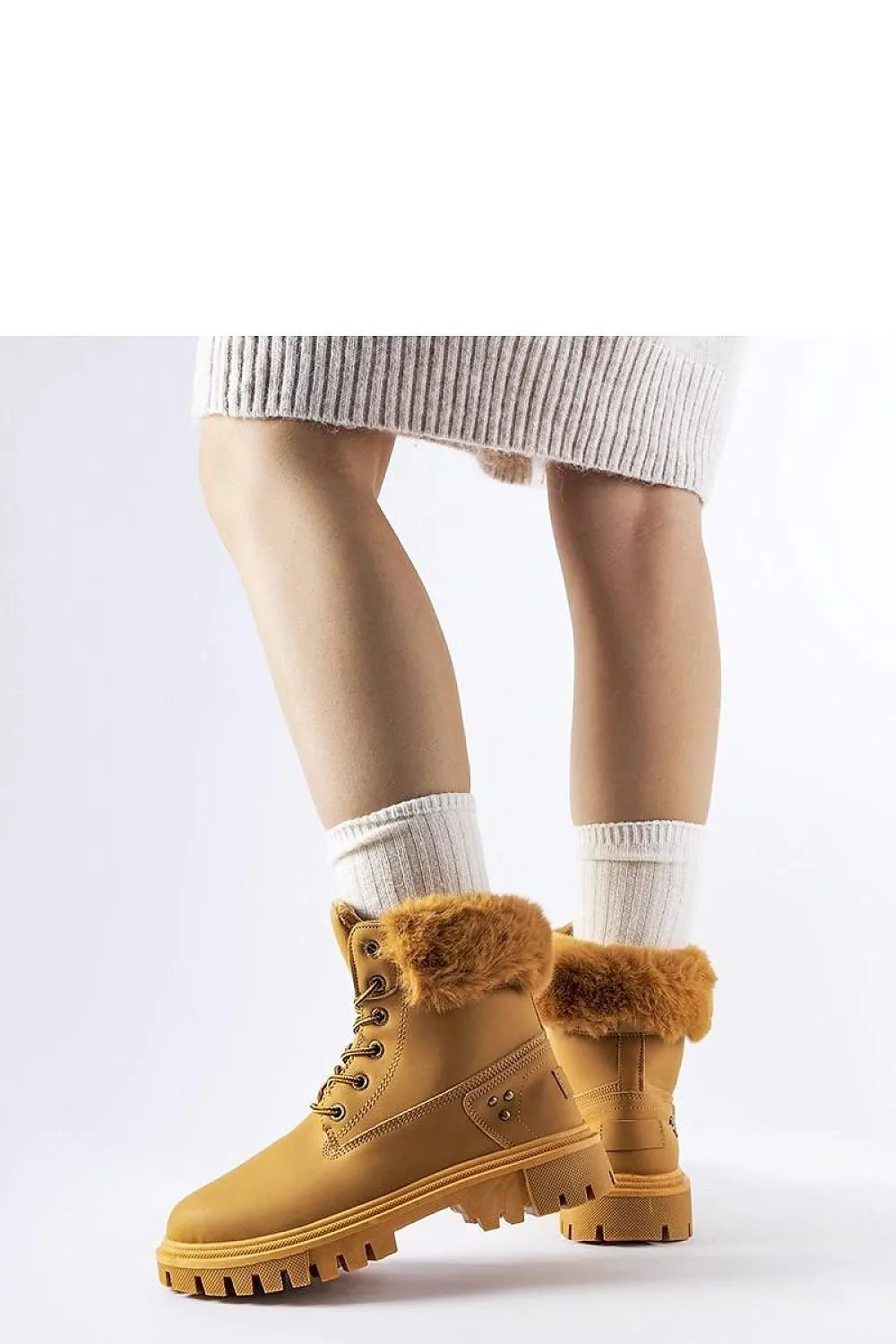 High-top boots with decorative fur