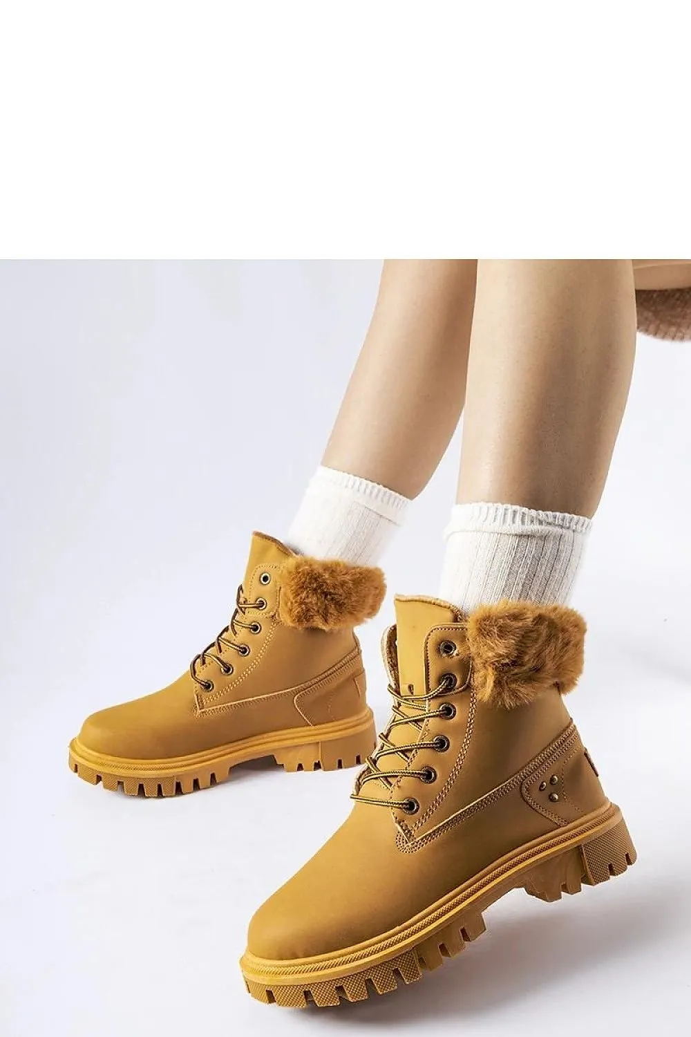 High-top boots with decorative fur